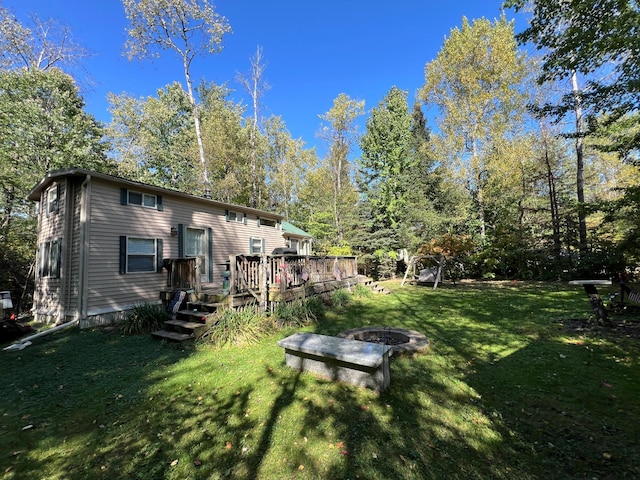 view of yard featuring a wooden deck