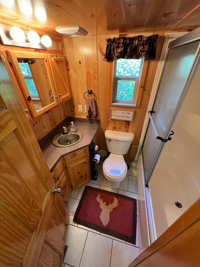 bathroom with wood ceiling, vanity, walk in shower, tile patterned flooring, and toilet