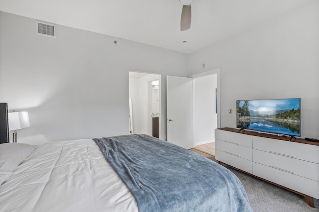 bedroom with ceiling fan and light colored carpet