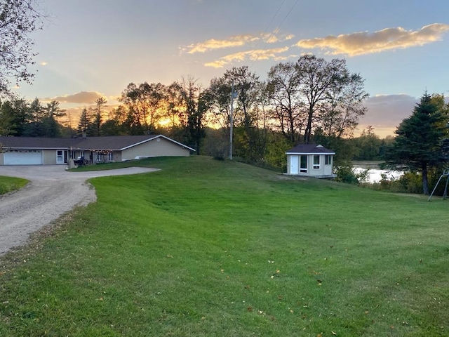 yard at dusk with a water view