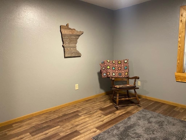 living area with hardwood / wood-style floors