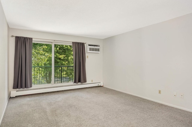 spare room featuring an AC wall unit, a baseboard heating unit, and carpet floors