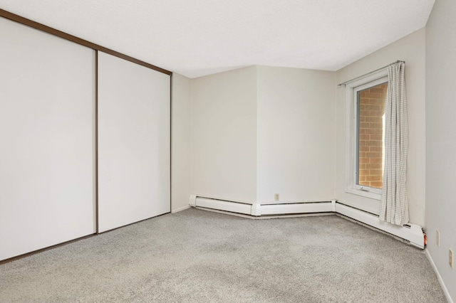 unfurnished bedroom featuring a closet and light carpet