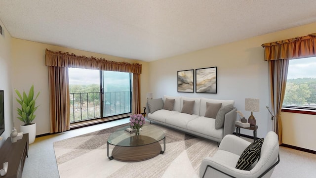 living room featuring a textured ceiling and light carpet