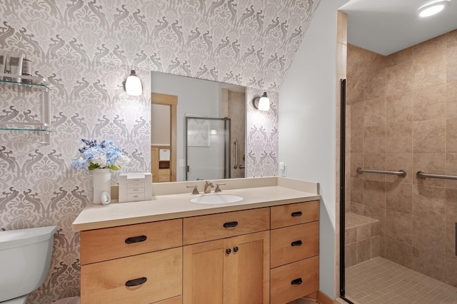 bathroom featuring walk in shower, vanity, and toilet