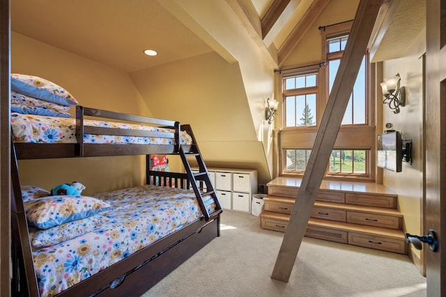 bedroom with light carpet, vaulted ceiling, and multiple windows