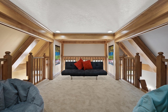 living room with lofted ceiling with beams, light carpet, crown molding, and a textured ceiling