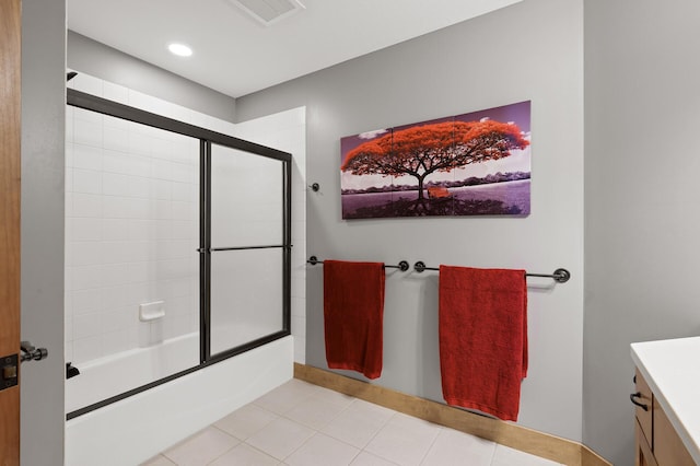 bathroom with tile patterned floors, combined bath / shower with glass door, and vanity