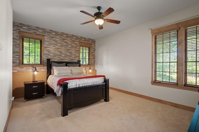 bedroom with light colored carpet and ceiling fan