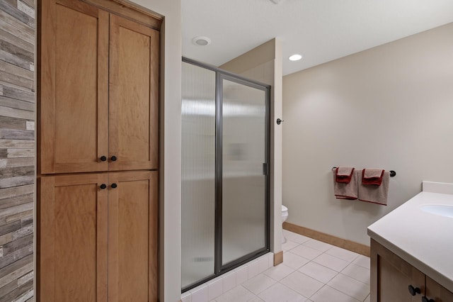 bathroom with tile patterned flooring, an enclosed shower, vanity, and toilet