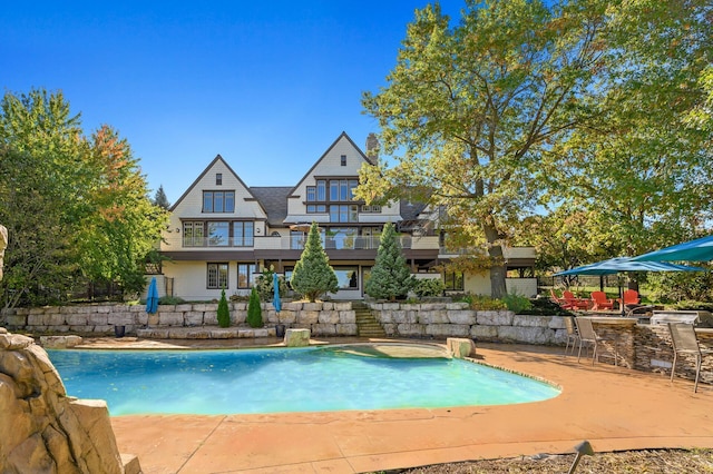 view of pool featuring a patio area