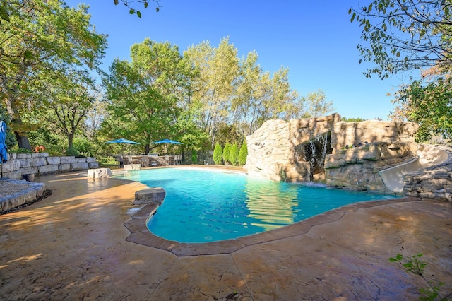 view of pool featuring a patio and pool water feature