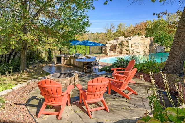 view of patio / terrace with a fenced in pool