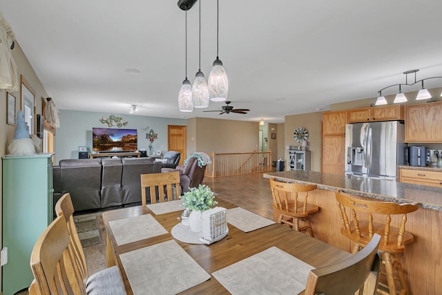 dining area featuring ceiling fan and hardwood / wood-style flooring