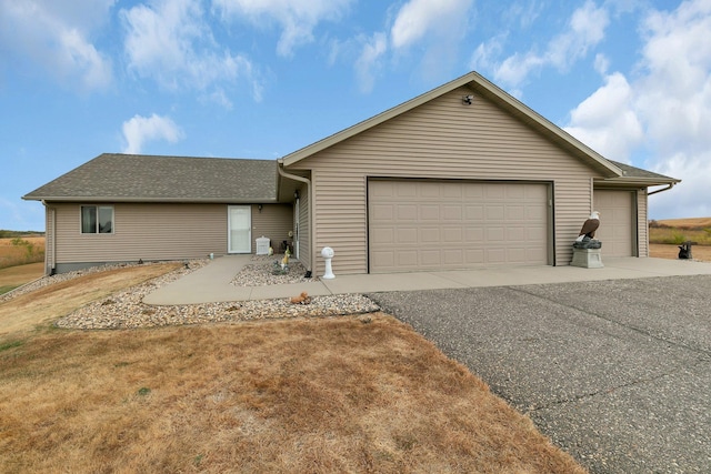 ranch-style home featuring a garage