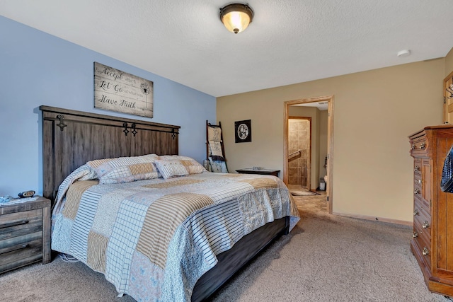 bedroom with light carpet, a textured ceiling, and connected bathroom