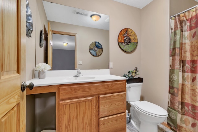 bathroom with a shower with curtain, vanity, and toilet