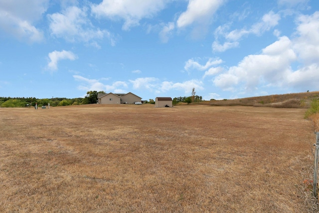 view of yard with a rural view