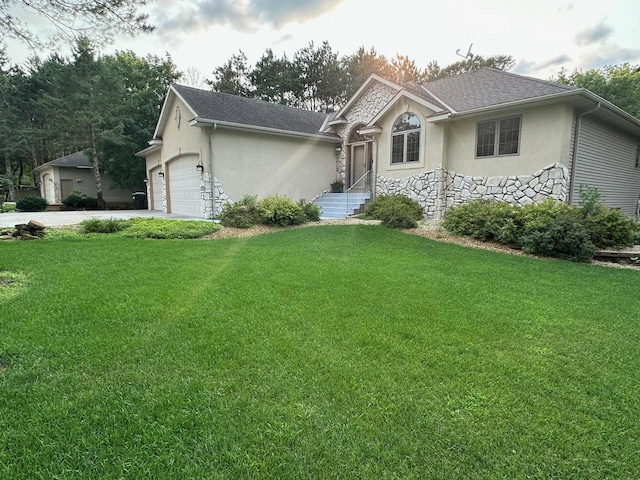 ranch-style home featuring a front yard and a garage