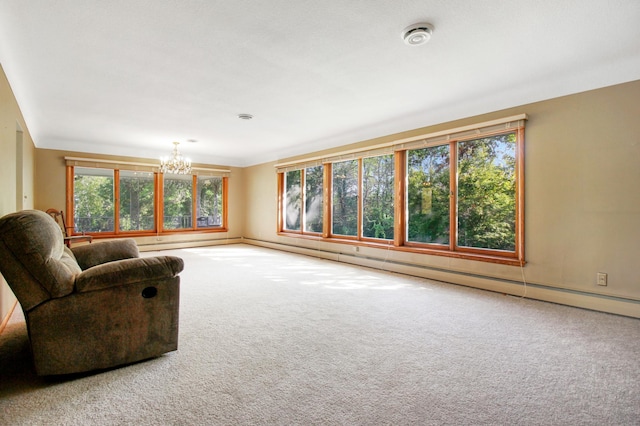 living room with carpet and a chandelier