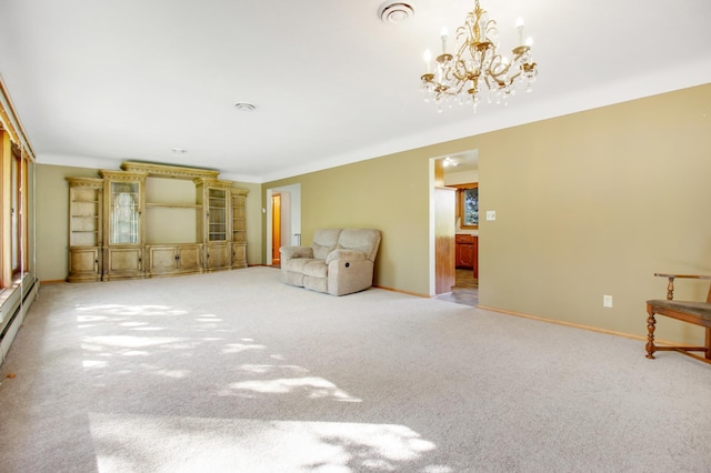 unfurnished living room with light carpet and a chandelier