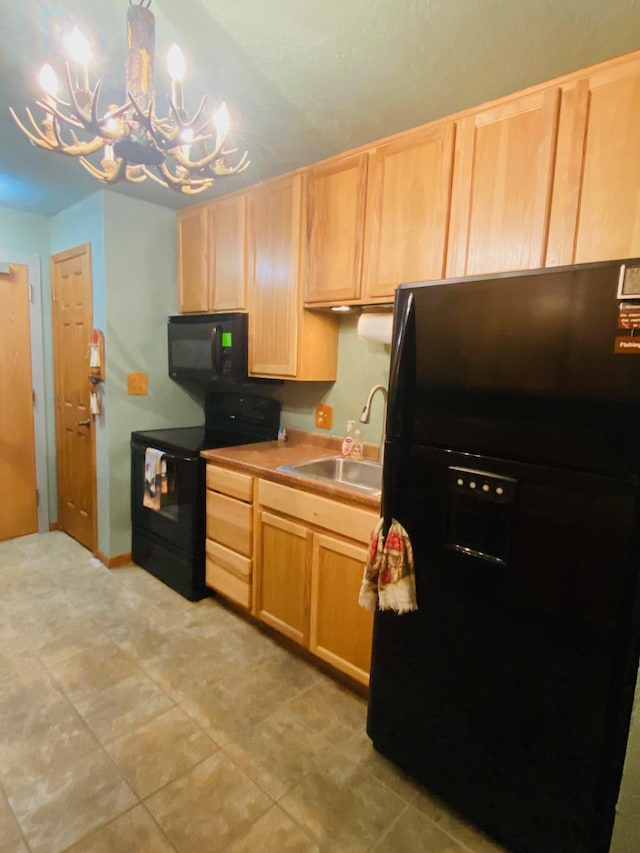 kitchen featuring pendant lighting, light brown cabinets, an inviting chandelier, black appliances, and sink