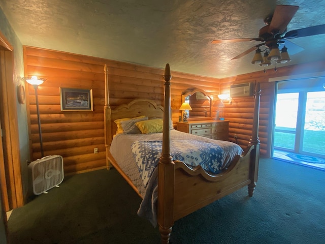 carpeted bedroom featuring rustic walls, a textured ceiling, ceiling fan, and a wall mounted AC