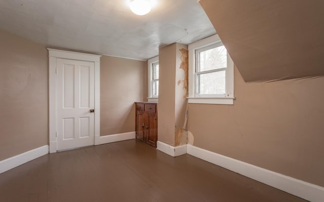 bonus room with hardwood / wood-style floors