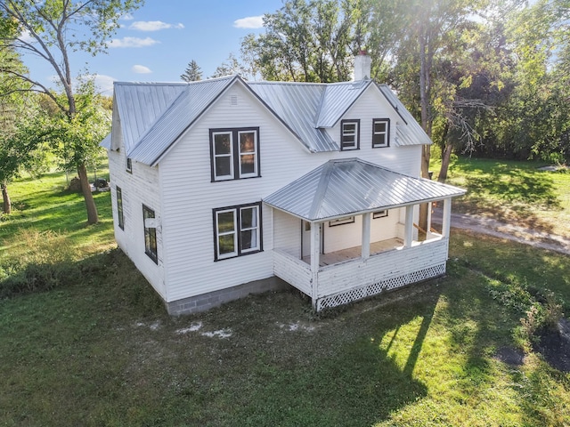 exterior space featuring a yard and a porch