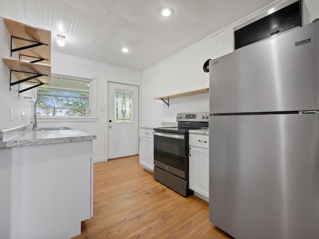 29693 120th St, Herman, MN 56248 - kitchen featuring white cabinets, open shelves, appliances with stainless steel finishes, a sink, and light wood-style floors