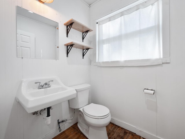 29693 120th St, Herman, MN 56248 - half bath with a sink, toilet, and wood finished floors
