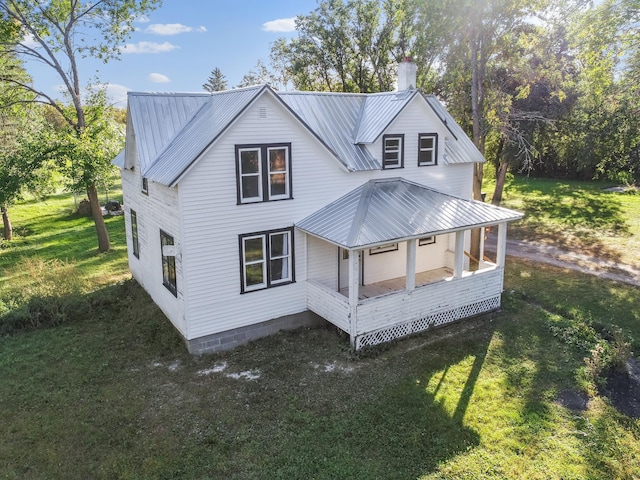 29693 120th St, Herman, MN 56248 - rear view of property with a yard, covered porch, a chimney, and metal roof