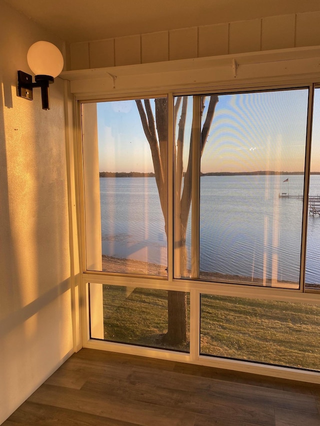 interior details featuring a water view and wood finished floors