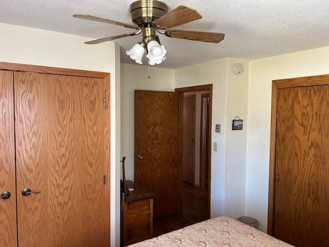 unfurnished bedroom featuring a textured ceiling and ceiling fan