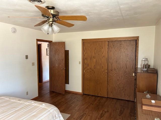 456 Cedar Ave, Westbrook, MN 56183 - bedroom with wood finished floors, a closet, a ceiling fan, and baseboards