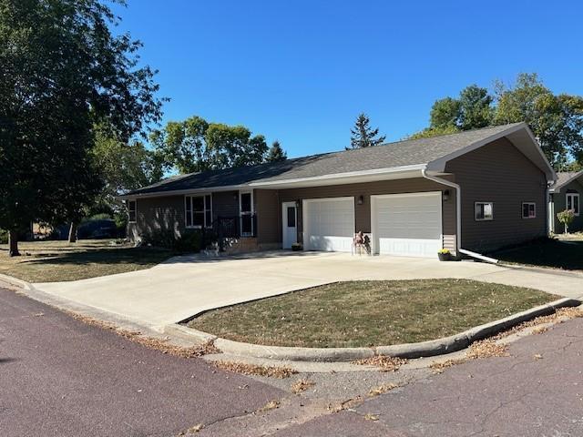 single story home with a front lawn and a garage