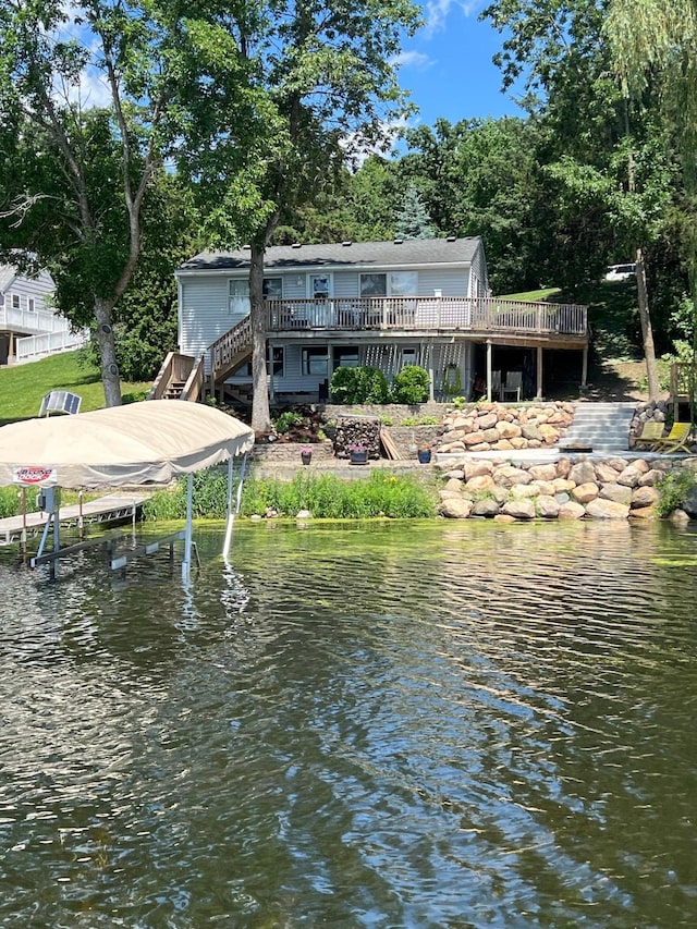 dock area featuring a deck with water view