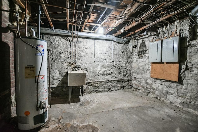 basement with water heater and electric panel