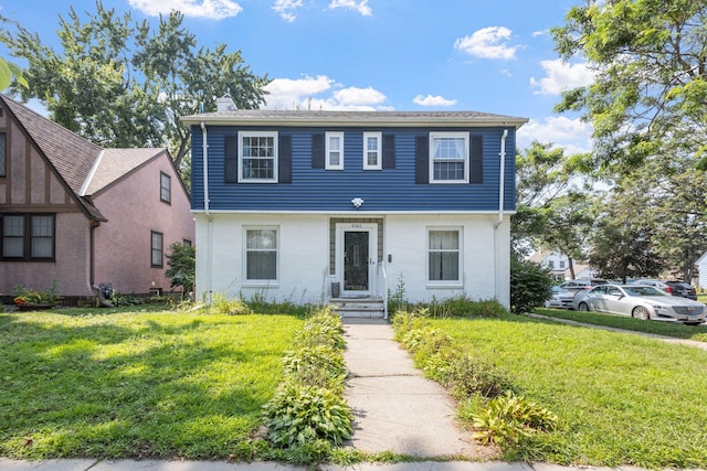 view of front of property with a front lawn