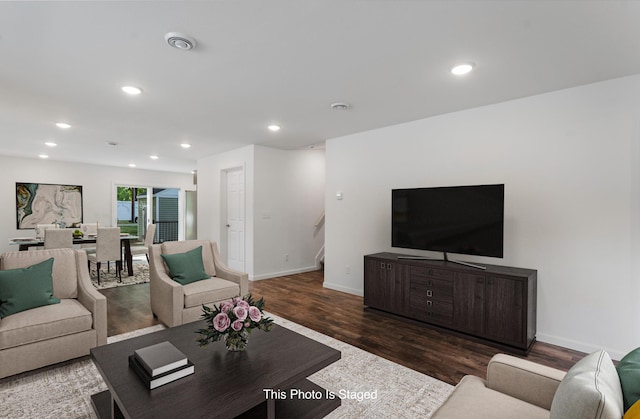 living room featuring dark hardwood / wood-style flooring