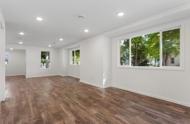 spare room with dark wood-type flooring