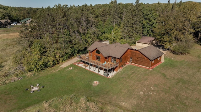 bird's eye view featuring a wooded view