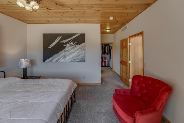 bedroom featuring baseboards, visible vents, wood ceiling, and carpet