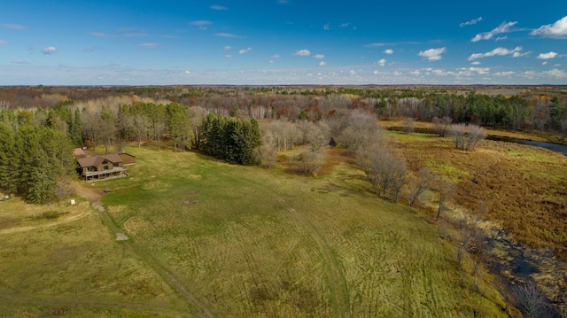 drone / aerial view featuring a view of trees