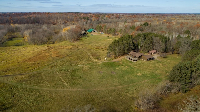 birds eye view of property with a wooded view and a rural view