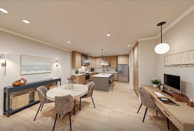 dining area with crown molding, sink, and light hardwood / wood-style floors