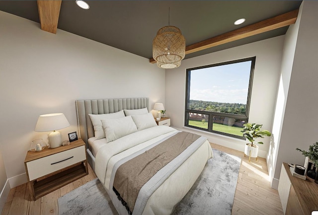 bedroom featuring hardwood / wood-style flooring and beam ceiling