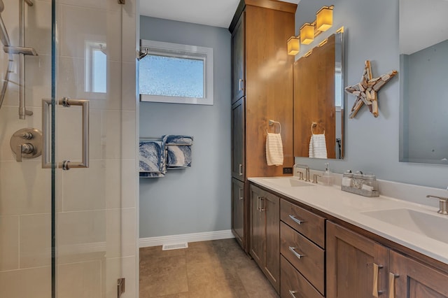 bathroom featuring vanity, tile patterned floors, and walk in shower