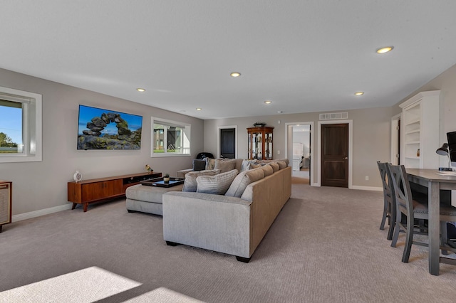 living room featuring light colored carpet