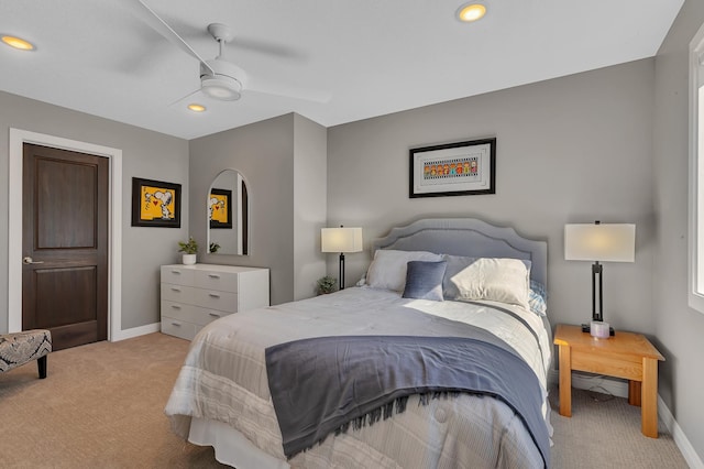 bedroom featuring ceiling fan and light carpet